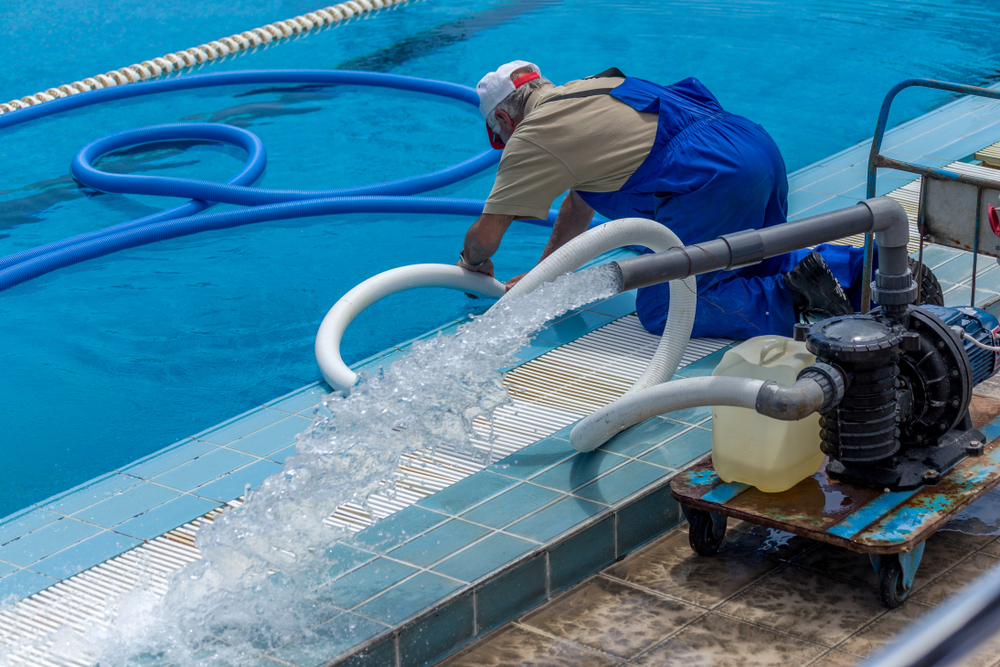 cleaning the sports pool with a cleaning water pump
